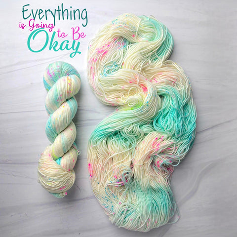 Everything is Going to be Okay - Hand dyed yarn, white light aqua with pink neon yellow and blue speckles