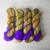 The Weaver's Cottage - Hand dyed yarn, Fingering Weight, assigned pooling inspired by ACOTAR by Sarah J Maas - Brown caramel green moss blue violet purple