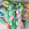 The Apothecary - Hand dyed variegated  yarn, Fingering Weight, inspired by Dungeon Crawler Carl book series - white pastel neon yellow pink blue and splashed in vibrant eon speckles