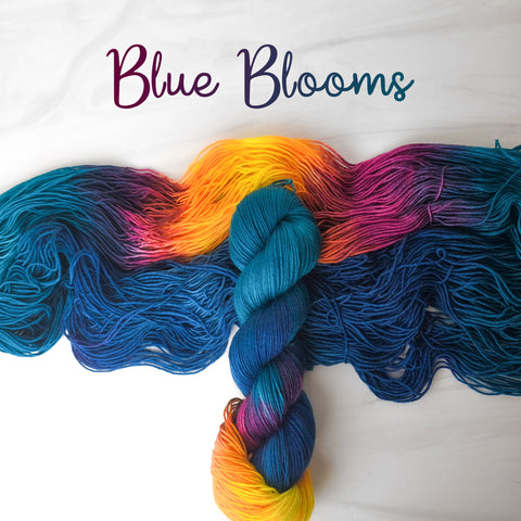 Blue Blooms - Hand dyed sock yarn - teal blue orange yellow red