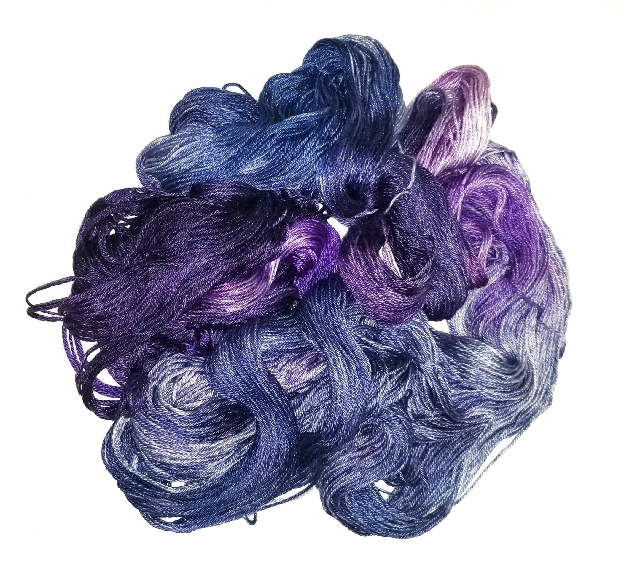 Purple and white variegated OmegaCrys baby weight yarn, 1.4 ounce ball
