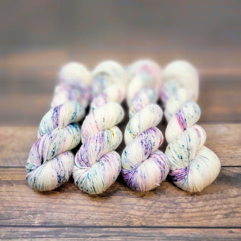 Frozen Flowers - Hand dyed variegated yarn - Merino Fingering to worsted white with purple lilac violet lavender green speckles