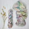 Pieces of April - Hand dyed sock yarn - pastel sage grey with speckles of pink blue green toffee