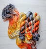 Dead Man's Hand -  Hand dyed variegated yarn - grey orange tan speckles