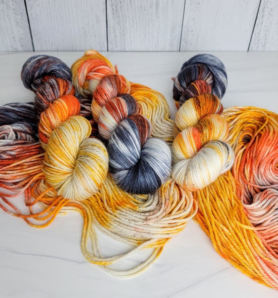 Dead Man's Hand - Hand dyed variegated yarn - grey orange tan