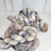 Pebbles in the Sand-  Hand dyed variegated yarn - grey with speckles of brown blue red green