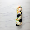 Neon Halloween - Hand dyed yarn, Fingering Weight, assigned color pooling - black and florescent orange green purple glows in black light