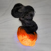 Jack O Lantern -Halloween collection - Hand dyed yarn, Fingering Weight, assigned color pooling -grey black and florescent orange glows in black light