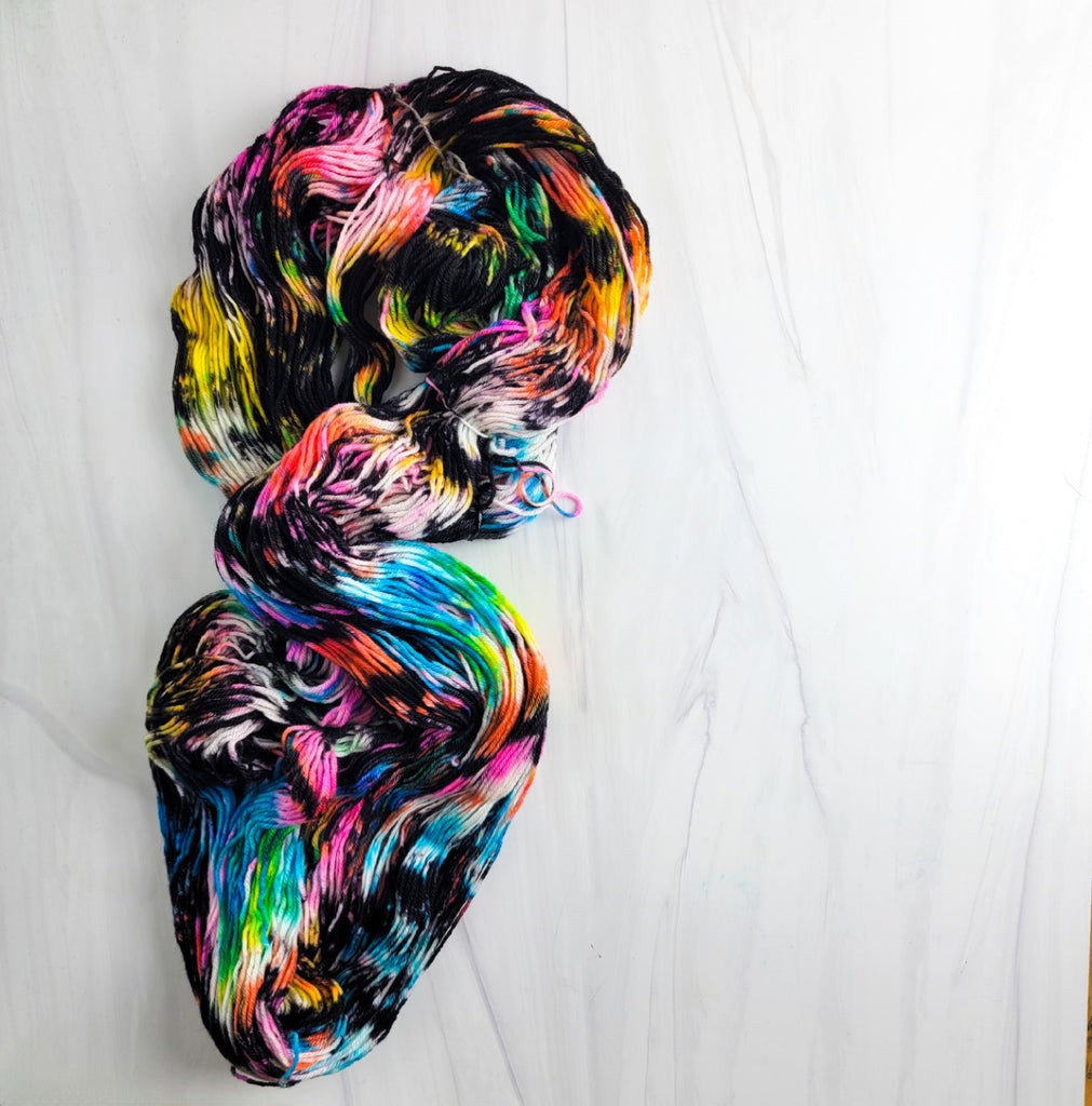 City Rain- Hand dyed yarn black rainbow speckled | Blue Barn Fiber