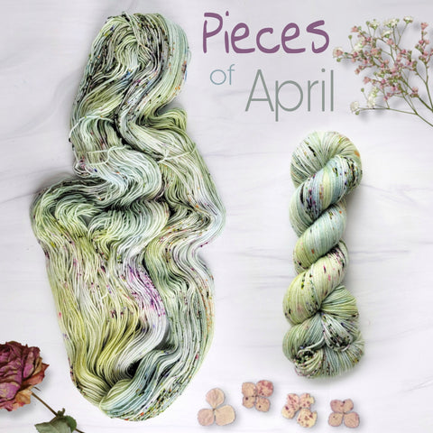 Pieces of April - Hand dyed sock yarn - pastel sage grey with speckles of pink blue green toffee