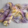 Fireflies -  Hand dyed variegated yarn - toffee caramel yellow gold purple orange speckles