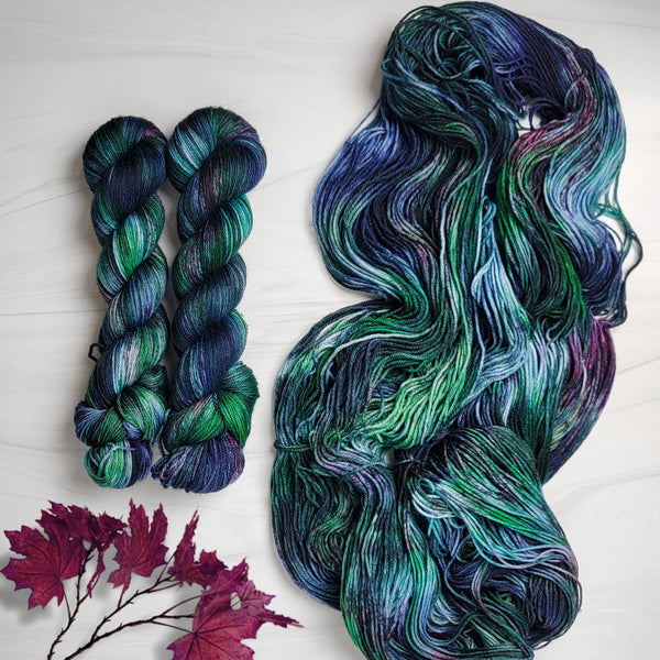 Dark Forest -  Hand dyed variegated yarn - green purple blue maroon