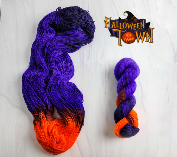 Halloween Town - Hand dyed yarn, Fingering Weight, assigned color pooling - purple violet and black and a pop orange