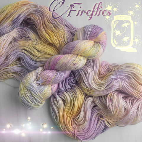 Fireflies -  Hand dyed variegated yarn - toffee caramel yellow gold purple orange speckles